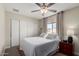 Bright bedroom with ceiling fan, closet, and window at 2671 W Bentrup St, Chandler, AZ 85224