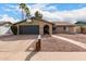 Charming single-Gathering home featuring a well-maintained front yard, spacious driveway and a basketball hoop above the garage door at 2671 W Bentrup St, Chandler, AZ 85224