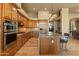 Gourmet kitchen with custom cabinets, stainless steel appliances, and a large center island at 27561 N 84Th Dr, Peoria, AZ 85383