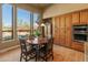 Charming breakfast nook with views of a lush outdoor space, near custom cabinetry at 27561 N 84Th Dr, Peoria, AZ 85383