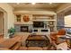 Comfortable living room features a stone fireplace and built-in shelving at 27561 N 84Th Dr, Peoria, AZ 85383