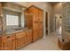 Bathroom featuring double sinks, granite counters, and tiled floors at 27561 N 84Th Dr, Peoria, AZ 85383