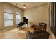 Room with piano and seating area featuring natural light from large windows at 27561 N 84Th Dr, Peoria, AZ 85383