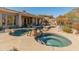 Stunning pool and spa area offers a luxurious outdoor experience with mountain views at 27561 N 84Th Dr, Peoria, AZ 85383