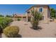 Lovely backyard with desert landscaping, a covered patio, and privacy fence at 2856 N 152Nd Ln, Goodyear, AZ 85395