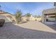 Large backyard featuring gravel landscaping, a privacy fence, and a covered patio area, great for outdoor activities at 2856 N 152Nd Ln, Goodyear, AZ 85395