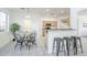 Open dining area features natural lighting and seamless flow into the modern kitchen, perfect for entertaining at 2856 N 152Nd Ln, Goodyear, AZ 85395