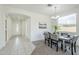 Bright dining area features a modern table set, stylish chandelier, and neutral decor for an inviting atmosphere at 2856 N 152Nd Ln, Goodyear, AZ 85395