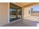 Cozy covered patio featuring a sliding glass door leading to the house at 2856 N 152Nd Ln, Goodyear, AZ 85395