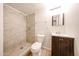 Bathroom features tiled walk-in shower, modern vanity, and updated fixtures at 2923 E Wahalla Ln, Phoenix, AZ 85050
