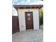 Exterior view of the bathroom building with an exterior door and decor at 2923 E Wahalla Ln, Phoenix, AZ 85050
