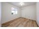 Cozy bedroom featuring durable floors, ceiling fan and a window for ample lighting at 2923 E Wahalla Ln, Phoenix, AZ 85050
