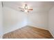 Bedroom featuring a ceiling fan, neutral walls, and modern wood-look flooring at 2923 E Wahalla Ln, Phoenix, AZ 85050