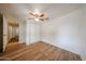 Bedroom showcasing wood-look floors, a ceiling fan, and a closet for storage at 2923 E Wahalla Ln, Phoenix, AZ 85050