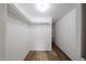 Walk-in closet with built-in shelving and hanging rods for ample storage space at 2923 E Wahalla Ln, Phoenix, AZ 85050