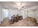 Dining room showcasing neutral paint, a ceiling fan, and access to the kitchen and front entryway at 2923 E Wahalla Ln, Phoenix, AZ 85050