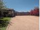Private driveway with wooden gates and beautiful foliage creating a peaceful retreat at 2923 E Wahalla Ln, Phoenix, AZ 85050
