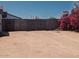 Private driveway with wooden gates and beautiful foliage creating a peaceful retreat at 2923 E Wahalla Ln, Phoenix, AZ 85050