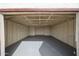 A spacious, unfinished two-car garage with fresh paint, ready for storage or customization at 2923 E Wahalla Ln, Phoenix, AZ 85050