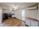 Open-concept room with modern flooring, mini-split AC, and stainless steel appliances at 2923 E Wahalla Ln, Phoenix, AZ 85050