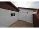 Side view of home, showing brick pavers, white exterior and small window at 2923 E Wahalla Ln, Phoenix, AZ 85050