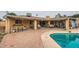 Spacious backyard patio featuring ample seating and an inviting pool, great for outdoor gatherings at 2929 N 55Th Pl, Phoenix, AZ 85018