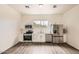 Modern kitchen featuring white cabinets, stainless steel appliances, and contemporary flooring at 2929 N 55Th Pl, Phoenix, AZ 85018