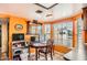 View of kitchen workspace with desk, window, mirror and terracotta tile flooring at 2929 N 55Th Pl, Phoenix, AZ 85018