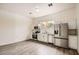 Bright kitchen featuring white cabinets, stainless steel appliances, and modern flooring at 2929 N 55Th Pl, Phoenix, AZ 85018