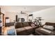 Comfortable living room with hard wood floors, ceiling fan, and a plush brown sofa at 2929 N 55Th Pl, Phoenix, AZ 85018