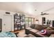 Living room with hardwood floors, fan, and comfortable seating area at 2929 N 55Th Pl, Phoenix, AZ 85018