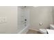 A clean, minimalist bathroom with a toilet and tub at 29909 N Yucca Dr, Florence, AZ 85132