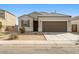 Inviting single-story home showcases a two car garage, neutral paint, and xeriscaping at 29909 N Yucca Dr, Florence, AZ 85132