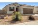 Charming single-story home featuring a two car garage and low maintenance desert landscaping at 29909 N Yucca Dr, Florence, AZ 85132