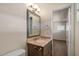 Bathroom featuring an updated vanity with granite countertop and updated fixtures at 3117 W Corrine Dr, Phoenix, AZ 85029