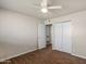 This bedroom features wood floors, a ceiling fan, and a closet at 3117 W Corrine Dr, Phoenix, AZ 85029