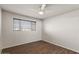 Bedroom featuring wood-look floors, a ceiling fan, and plenty of natural light at 3117 W Corrine Dr, Phoenix, AZ 85029