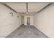 A clean, empty garage with painted walls and a concrete floor at 3117 W Corrine Dr, Phoenix, AZ 85029