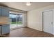 Stylish eat-in kitchen with wood-look floors, modern fixtures, and sliding door access at 3117 W Corrine Dr, Phoenix, AZ 85029