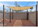 A shady pergola sits at the back of the yard at 3117 W Corrine Dr, Phoenix, AZ 85029