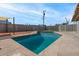 Backyard swimming pool with a concrete deck and secure fencing, great for leisure and safety at 3117 W Corrine Dr, Phoenix, AZ 85029