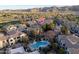 Aerial view of a luxury home community with a shared pool and beautiful mountain views at 3131 E Legacy Dr # 2101, Phoenix, AZ 85042