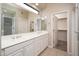 Bright bathroom featuring a double sink vanity, a large mirror, and a skylight to allow for an abundance of natural light at 3131 E Legacy Dr # 2101, Phoenix, AZ 85042