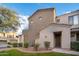 Charming home with a well-manicured front yard, green grass, and desert landscaping at 3131 E Legacy Dr # 2101, Phoenix, AZ 85042