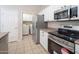 Well-organized kitchen featuring stainless steel appliances, plenty of cabinet space, with easy access to the laundry area at 3131 E Legacy Dr # 2101, Phoenix, AZ 85042