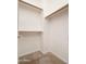 An empty carpeted walk in closet with shelving and hanging rods at 3131 E Legacy Dr # 2101, Phoenix, AZ 85042