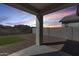 Covered back patio with neutral decor and gravel landscaping provides a relaxing outdoor living space at 31400 N 130Th Ave, Peoria, AZ 85383