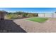 Large backyard with desert landscape, artificial grass, and perimeter block wall at 31400 N 130Th Ave, Peoria, AZ 85383