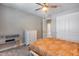 Cozy bedroom with a ceiling fan, neutral paint, and a comfortable-looking bed at 31400 N 130Th Ave, Peoria, AZ 85383