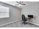 Bedroom featuring a window, a gaming chair, and a desk setup at 31400 N 130Th Ave, Peoria, AZ 85383